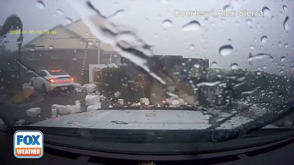 An Ocala, Florida, man recorded video of a severe storm that blew over his car and shattered his window while waiting in a restaurant's drive-thru on Saturday. 