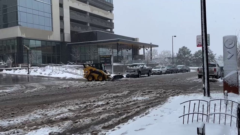 Crews are busy trying to clear snow from roads in the Denver area after heavy snowfall was reported Wednesday night and Thursday morning.