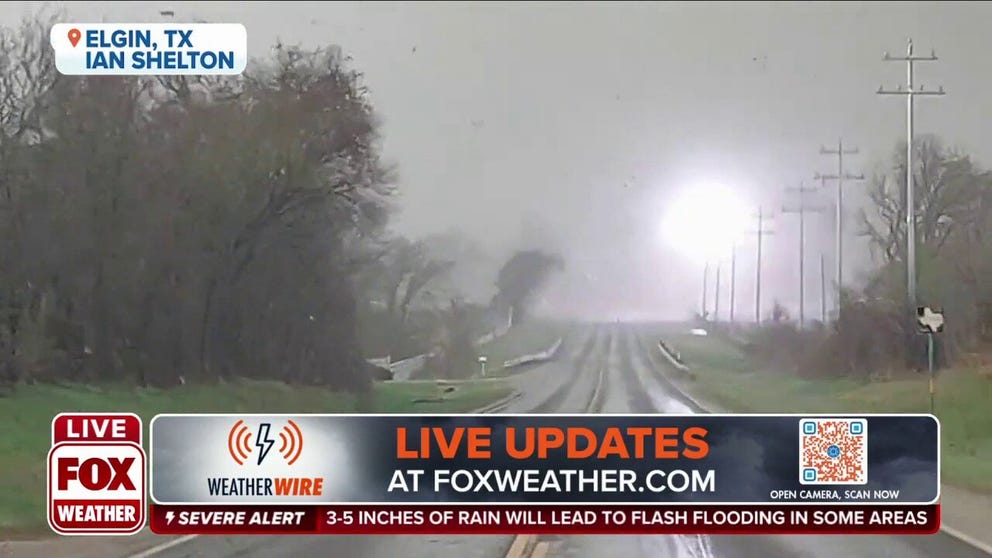 A transformer exploded as a tornado moved across a road in Elgin, Texas on Monday. 