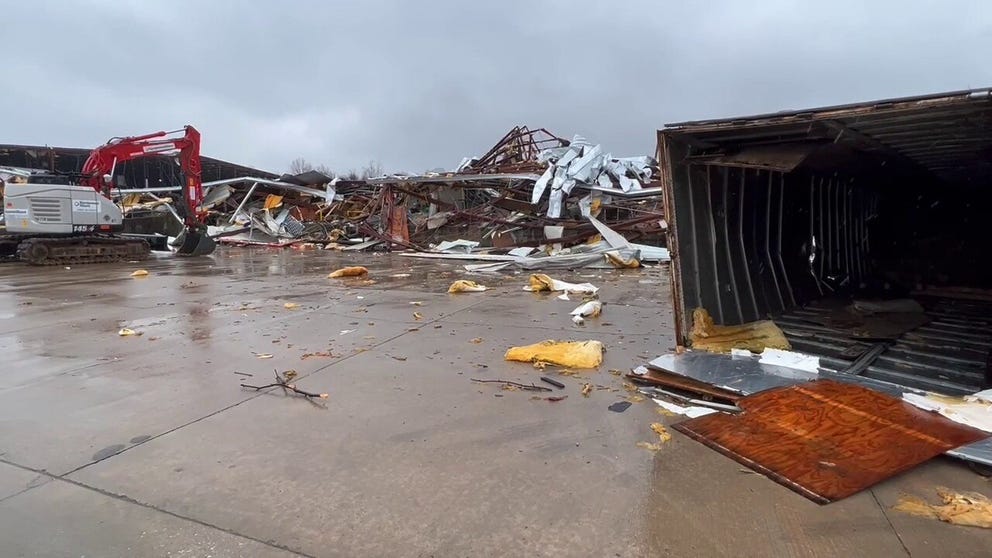 An EF-2 tornado tore apart a warehouse in Springdale and overturned trucks.