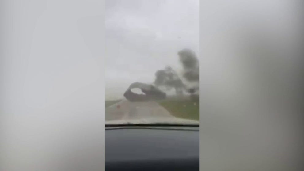 Watch as a car gets caught in the middle of a tornado in Ulmer, South Carolina on Tuesday.