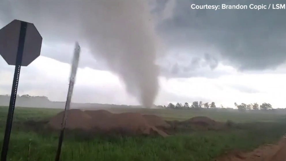 Video captures a tornado on the ground tearing through fields in East Sumter County, Georgia. (Video: Brandon Copic / LSM)