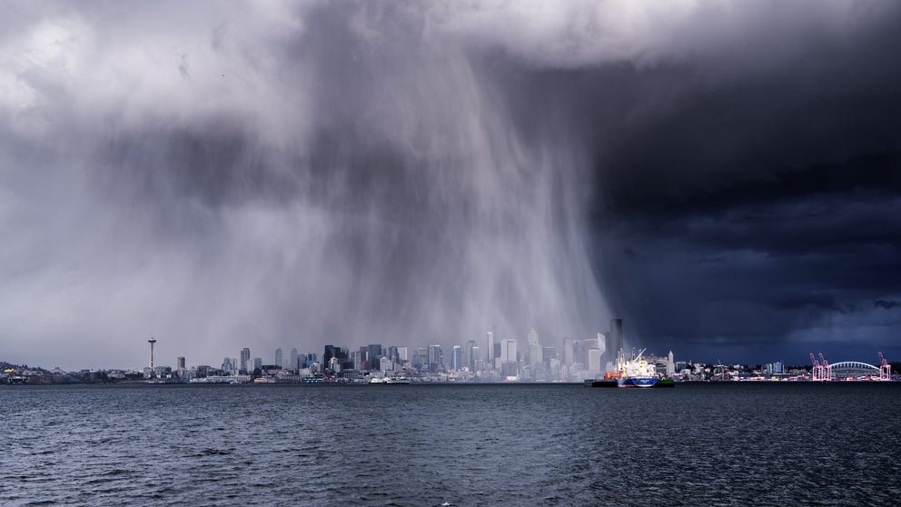 Ribbons of hail fell across Downtown Seattle Saturday putting on a show of nature across the Emerald City's skyline. 