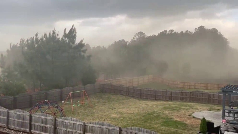 Gusty winds create a pollen storm in Wake Forest, North Carolina on Tuesday afternoon. 