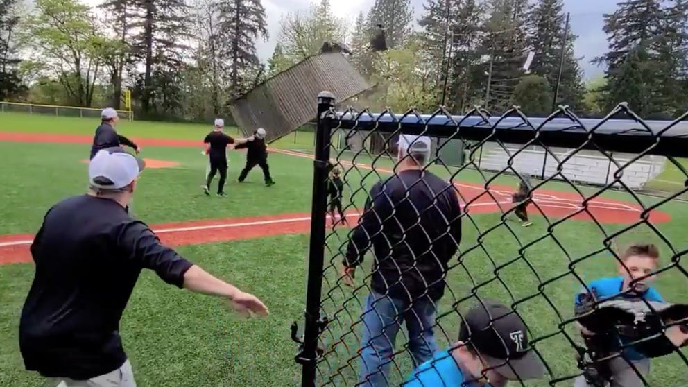 A gustnado sent players and coaches scrambling after it tore the roof off a dugout at a ball field near Portland, Oregon on Saturday. (Video courtesy: Jared Ravich)