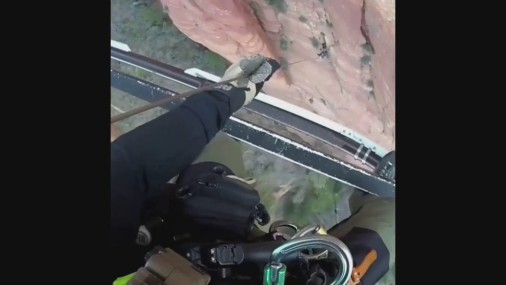 The Utah Department of Public Safety rescued an injured climber stranded on a cliff in Zion National Park by helicopter. The climber had to spend the night in the elements. The climber is at the upper portion of the screen.