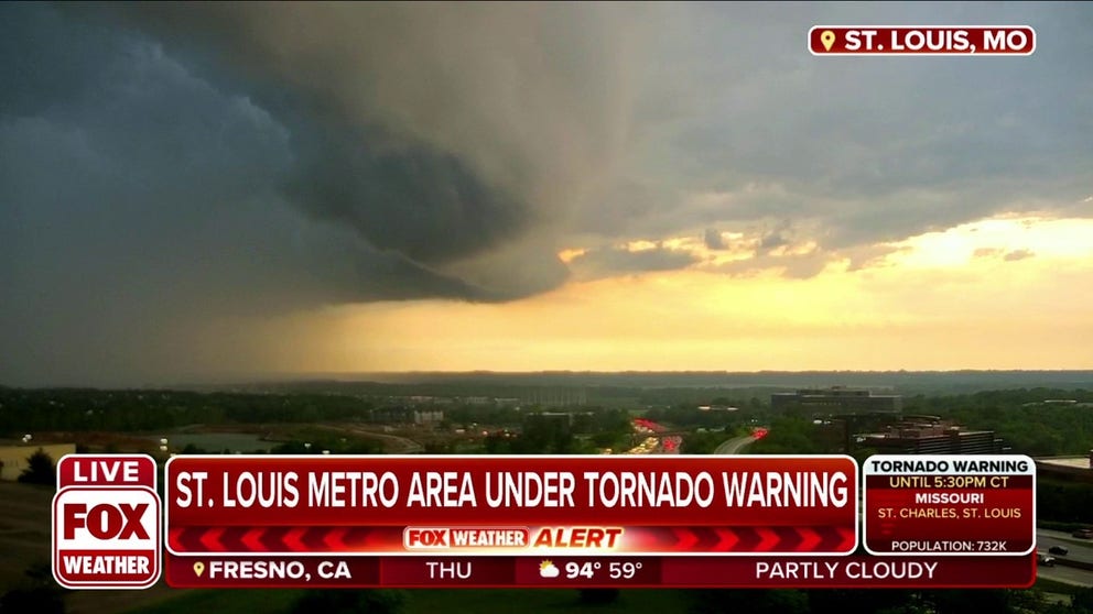 Ominous clouds replace sunny skies in St. Louis, Missouri during tornado warning. 