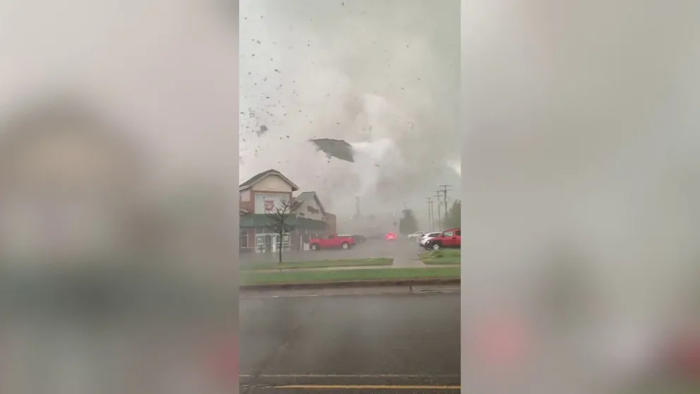 A tornado is caught on video tossing debris and ripping through Gaylord, Michigan. (Video: @cm_chrismorris/Twitter)