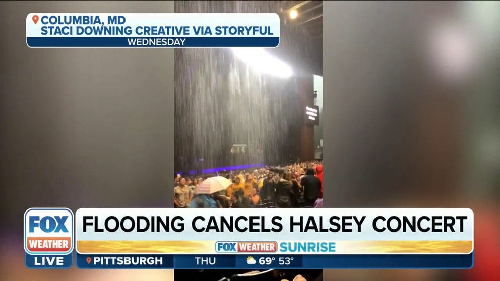 Fans were soaked as the venue flooded while they waited for a Halsey concert to start in Columbia, MD during a tornado warning on Wednesday night. 