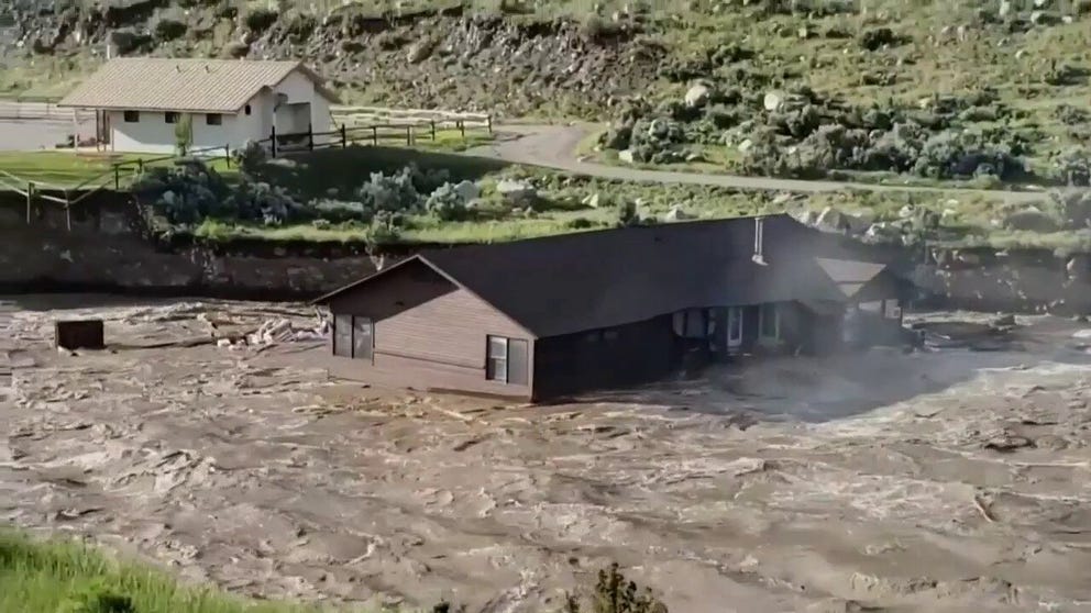 Watch as a house falls into a river as Yellowstone National Park floods in Gardiner, Montana. 