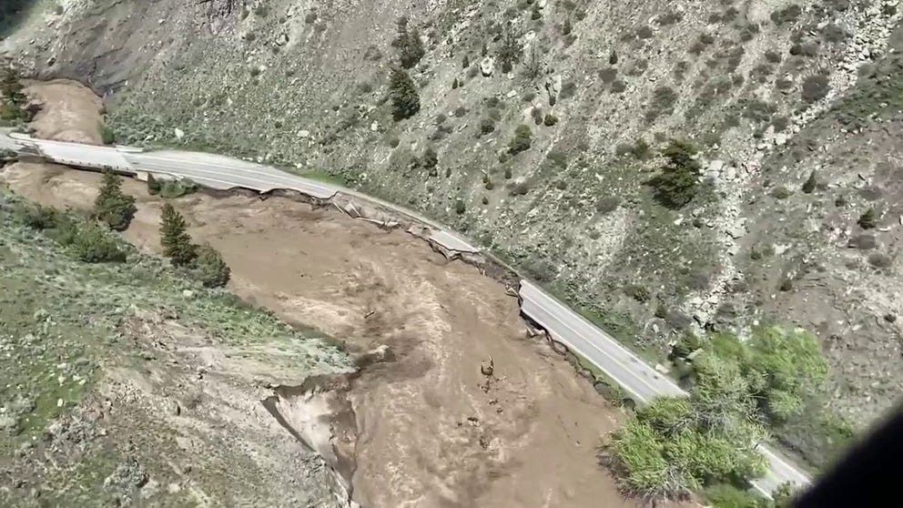 Aerial view shows flooding taking place at Yellowstone's North Entrance Road through the Gardner Canyon between Gardiner, Montana, and Mammoth Hot Springs.