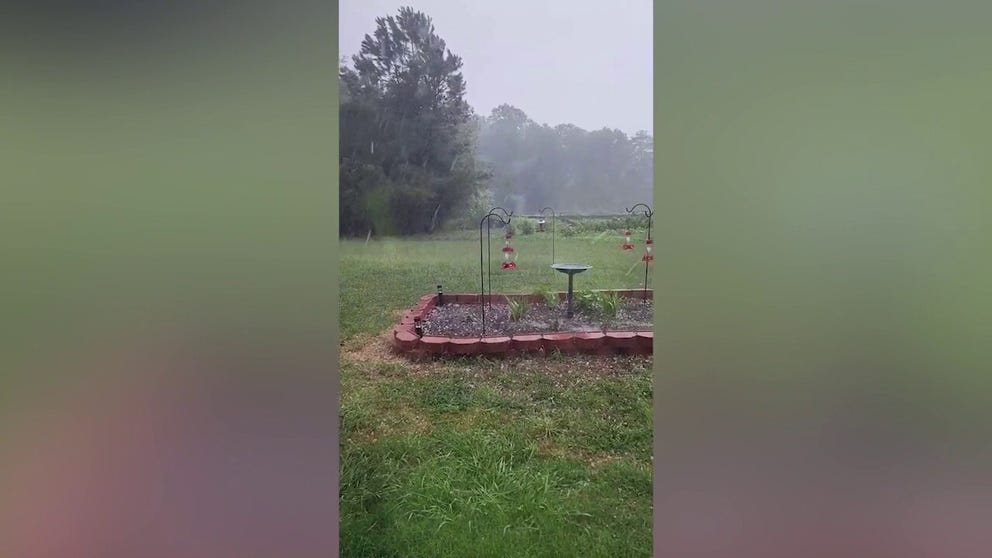 Hail coats ground in Winston-Salem, North Carolina on Friday. More than 200,000 have lost power in the Tarheel State. (Video: @DecryptedGamer/Twitter)