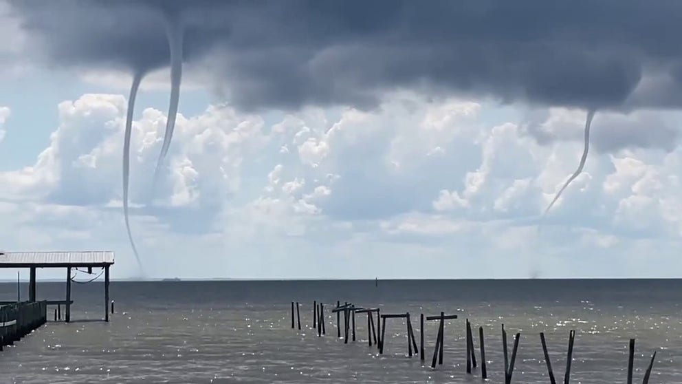 Multiple waterspouts are captured on video forming over Mobile Bay, Alabama on Monday. (Video: @kelly_dubs/Twitter)
