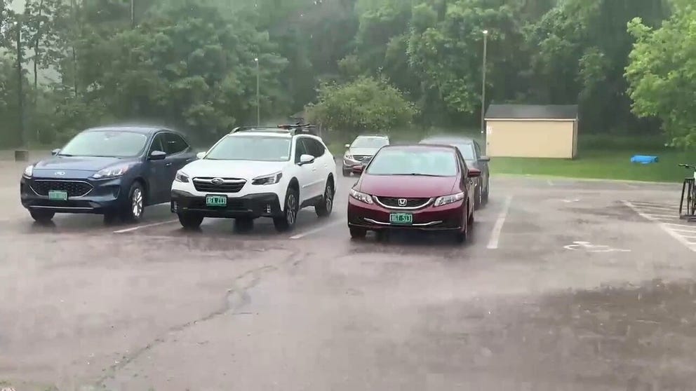 Torrential rain hits Burlington, Vermont as a cold front moves through the Northeast on Monday. 