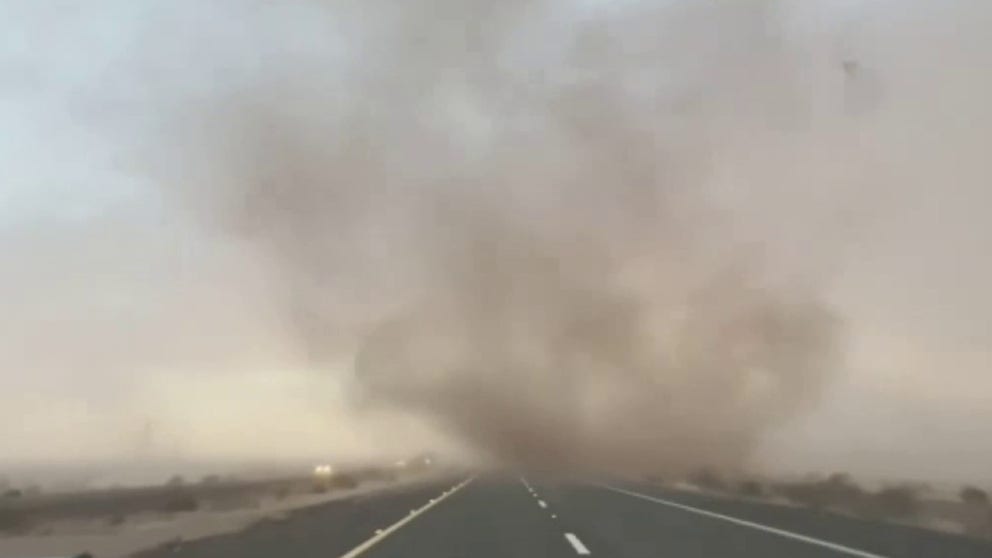A storm chaser films the moment he accelerates straight into a dust devil on Interstate 8 in Sentinel, Arizona. (Video: Mike Olbinski via Storyful)