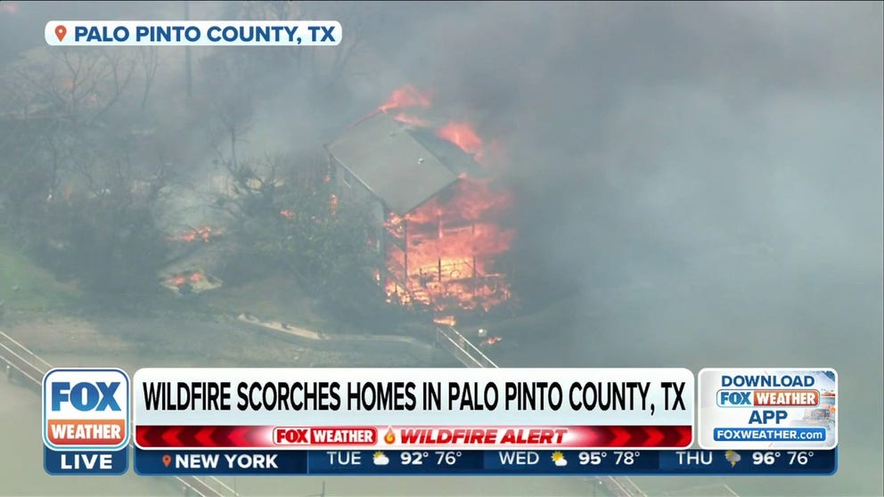 A new wildfire is burning homes in Palo Pinto County, Texas on Monday. Several lake houses have been destroyed in the area.  