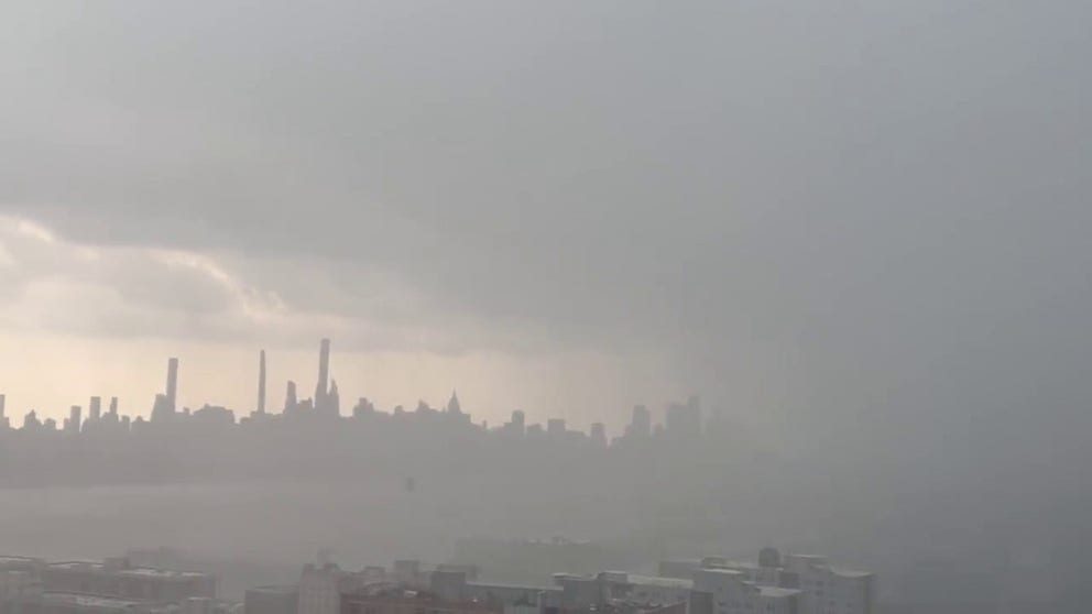 A video posted to social media shows heavy rain falling in New Jersey before approaching the New York City skyline on Monday, July 25.