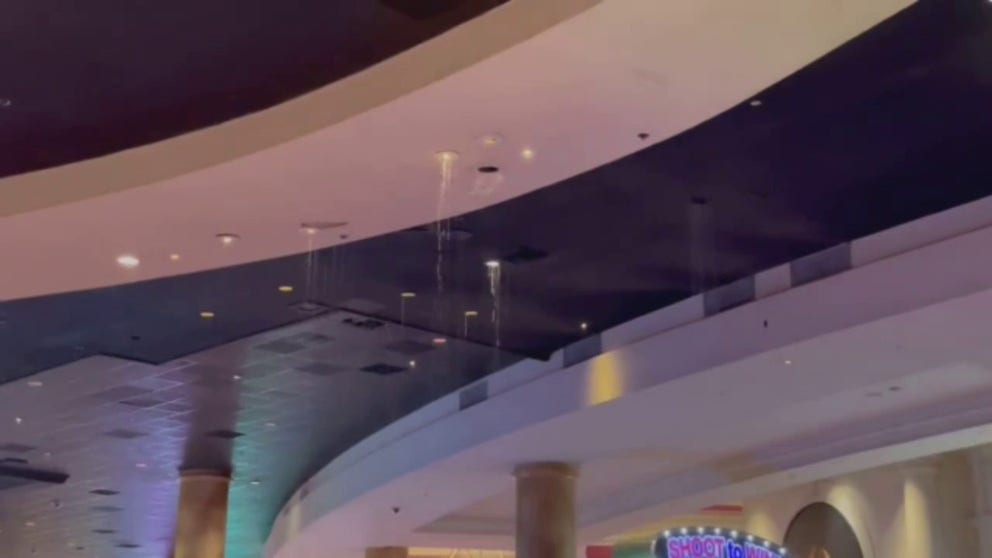 Water poured through a Las Vegas casino ceiling due to heavy rain, which triggered flash flooding along the Las Vegas Strip. 