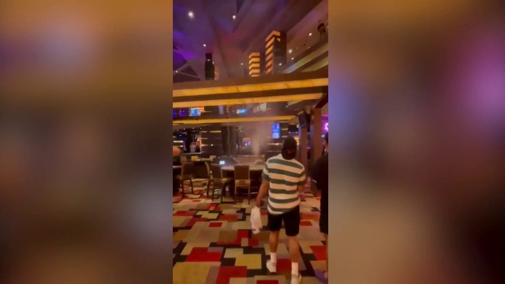 A video shared by Twitter user David Woods shows water leaking through the ceiling into the Planet Hollywood Resort and Casino on the Las Vegas Strip. Streams of water can be seen pouring onto a table just before a ceiling panel falls, and then another.