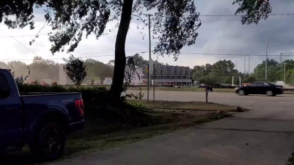Strong winds whip dust across a street in Rochester Hills, Michigan on Wednesday. (Video: @MiWxAnthony/Twitter)