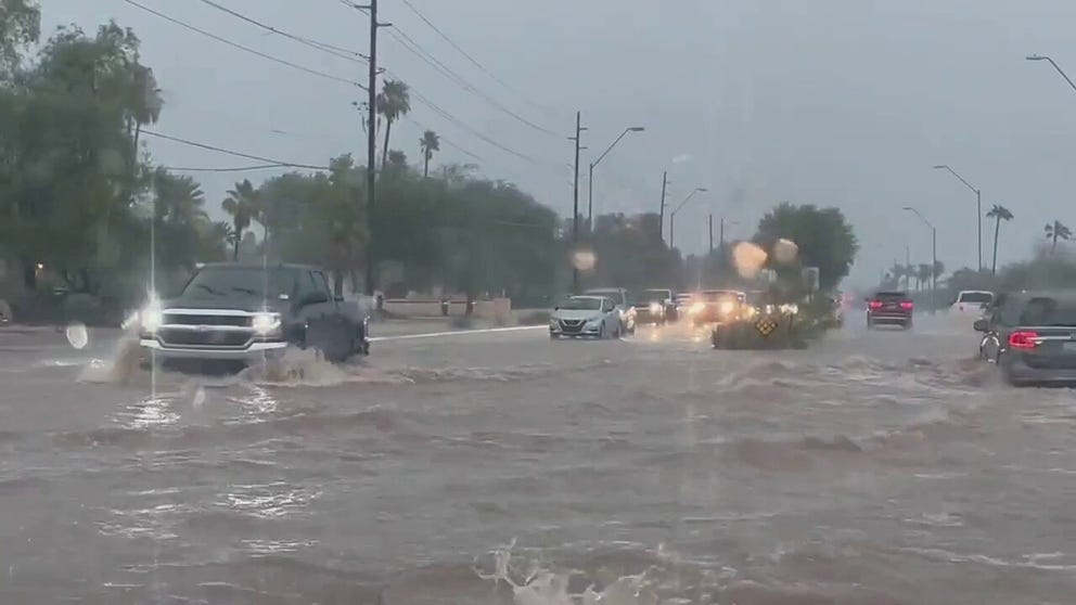 Heavy rain associated with monsoon storms flooded streets in Scottsdale, Arizona, on Friday.
