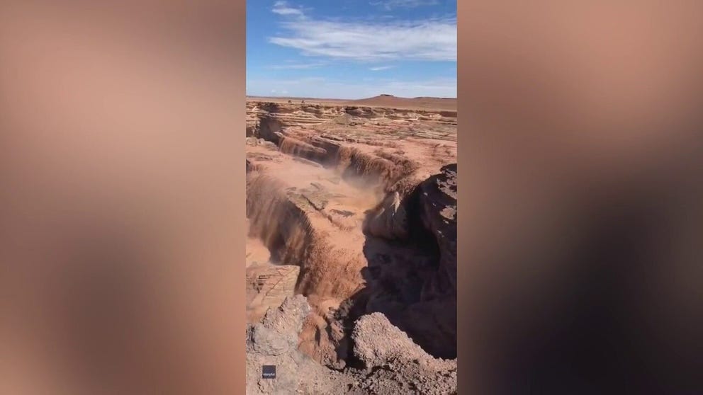 A visitor caught a view of this part-time waterfall on July 31. Monsoon rains flooded the river which poured over the Grand Falls near Leupp, Arizona nicknamed the Chocolate Falls due to the color of the muddy water.