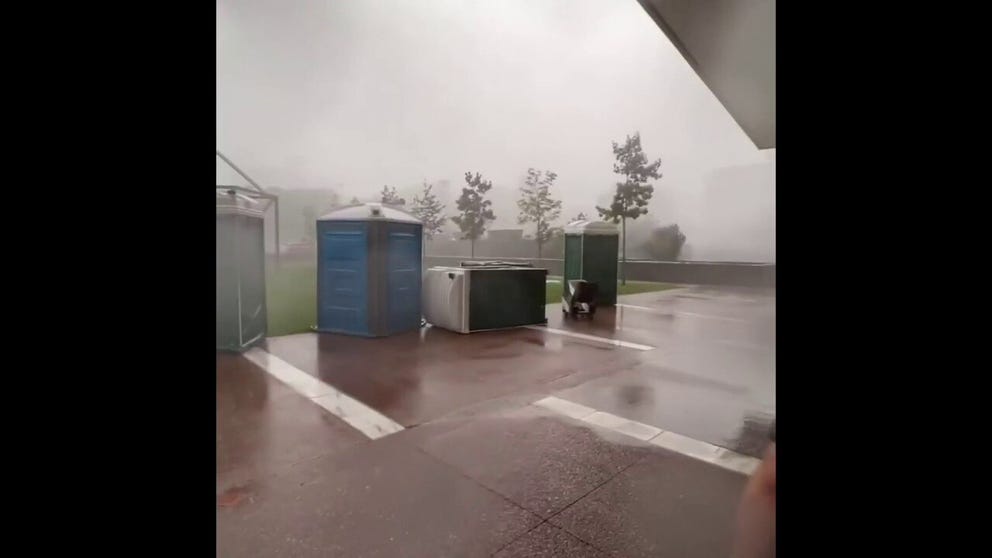 Strong wind and heavy rain caused Porta Potties outside the Empire State Plaza to blow over in Albany, New York on Wednesday.