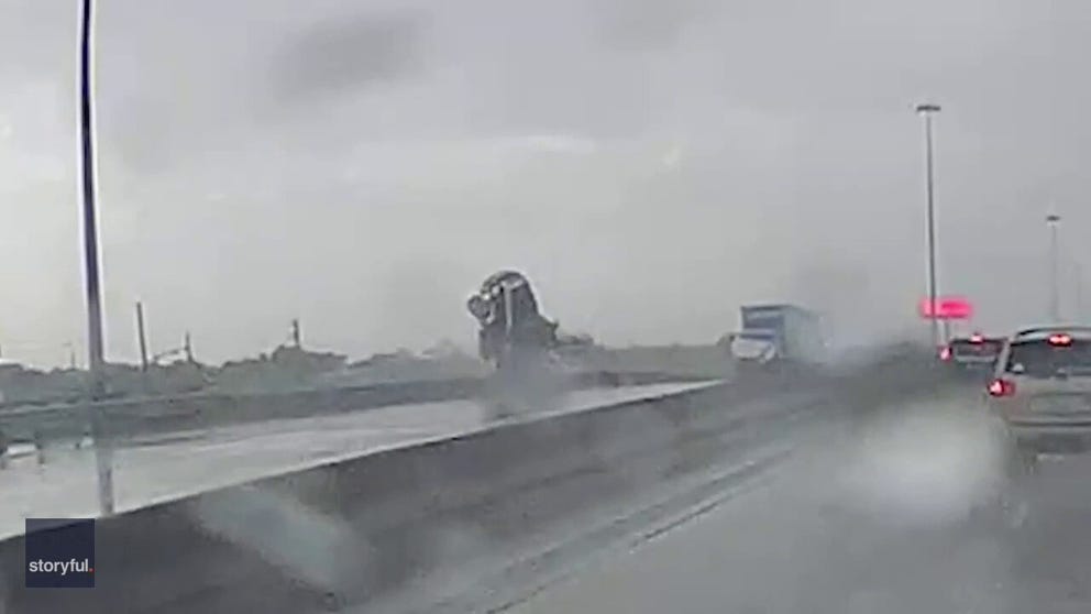 A truck driver was able to jump from a moving 18-wheeler as it went off an overpass on Highway 225 in Houston after hydroplaning. 