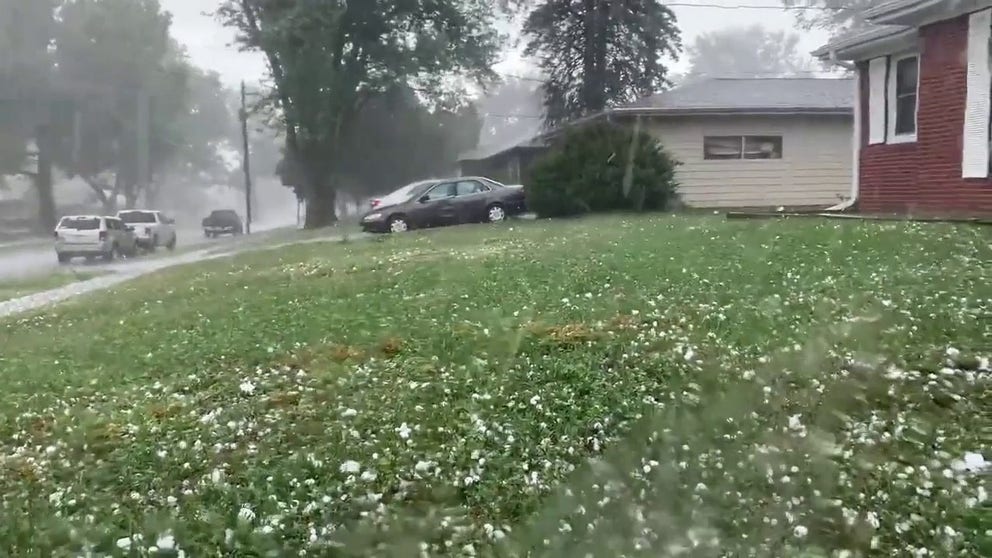 Video captures hail bouncing off a car and coating the ground of Des Moines, Iowa on Friday. (Credit: @MTitaniumman/Twitter)