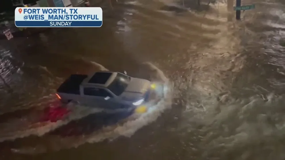 Drivers decided to maneuver through flooded streets in Forth Worth, Texas late Sunday night. 