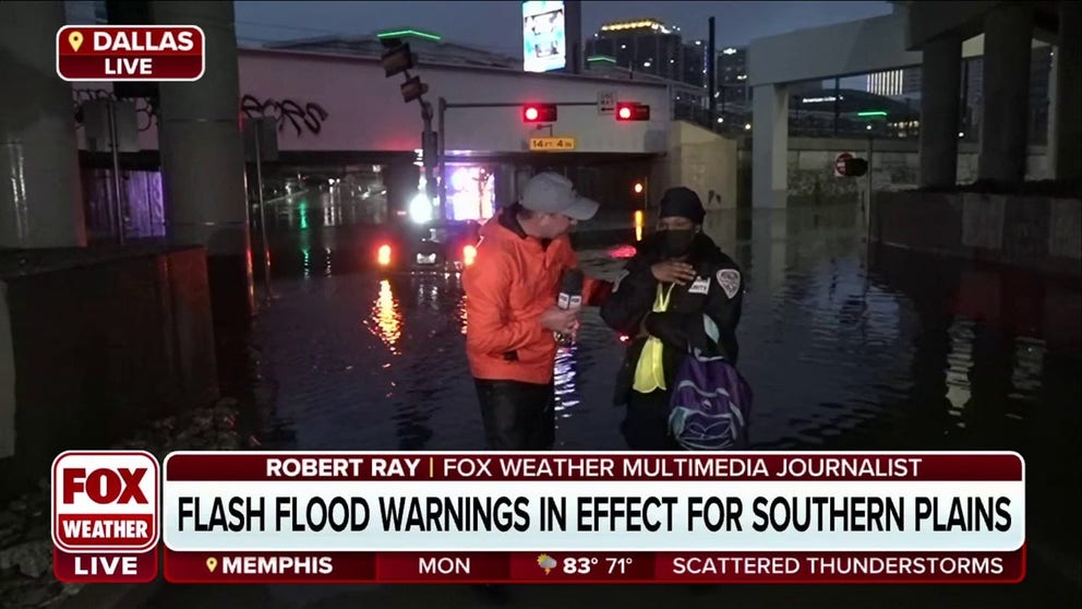 FILE VIDEO - FOX Weather's Robert Ray helped rescue a woman from her submerged car in Dallas. She said, "I thought I was going to die."