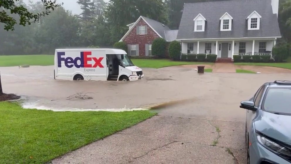 Video shows a FedEx truck driving through a flooded roadway in Brandon, Mississippi. 