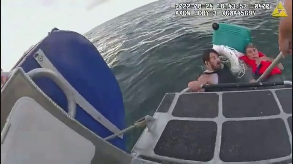 Officers rescued a father and son from the water after their boat sank near Boston, Massachusetts, on Wednesday, Aug.24, 2021, according to the Boston Police Department.