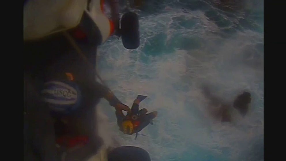 Watch a Coast Guard rescuer pull a fisherman out of waves churned up by Tropical Storm Earl.