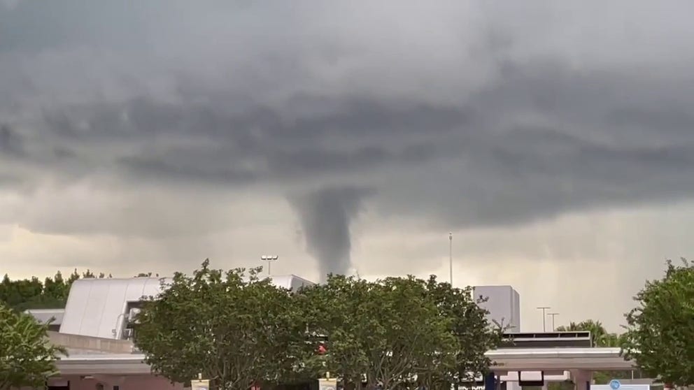 Apparent funnel cloud was captured on video from Disney World on Thursday evening. (Video credit: Adam and Kristen Stream Disney Facebook page)