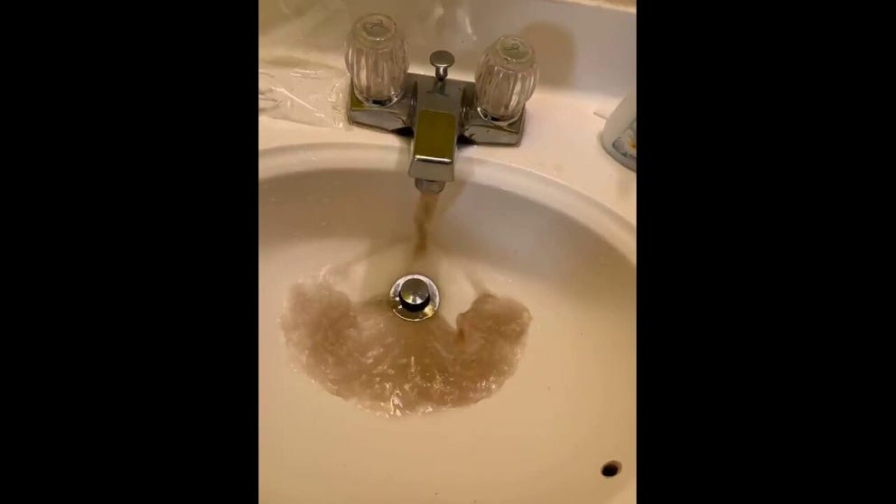 Video shows murky water flowing from a Jackson, Mississippi tap after the area's boil-water advisory was lifted.  (Credit: Mallory Storm/LOCAL NEWS X /TMX)