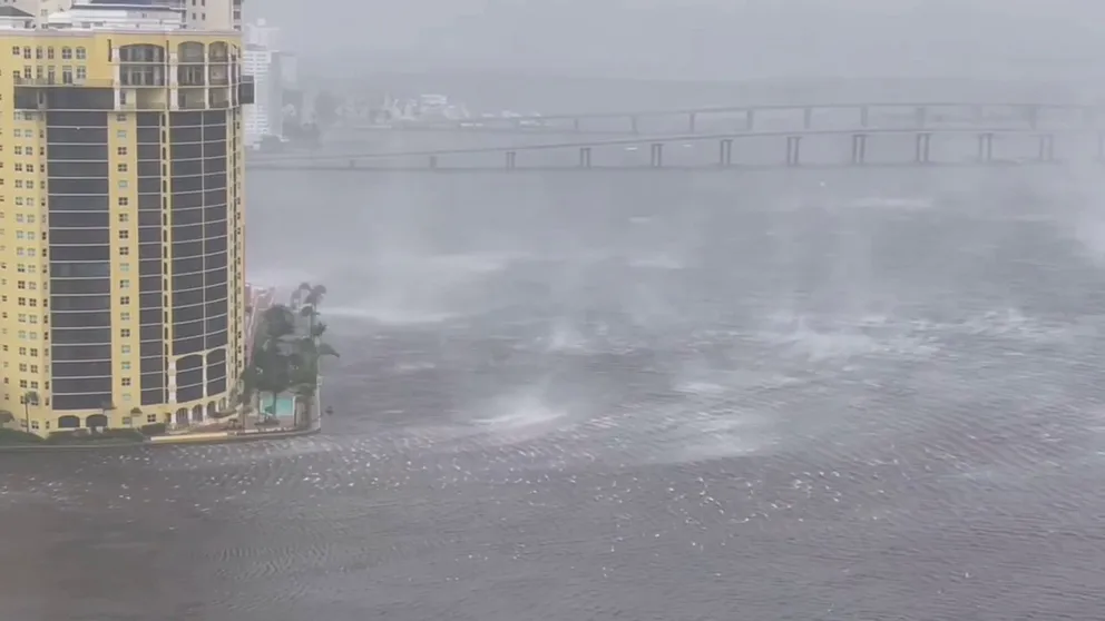 A storm chaser caught the violent wind, rain and waves from a high-rise in Ft. Myers as powerful Category 4 Hurricane Ian made landfall just to the north. Watch a boat that broke free adrift.