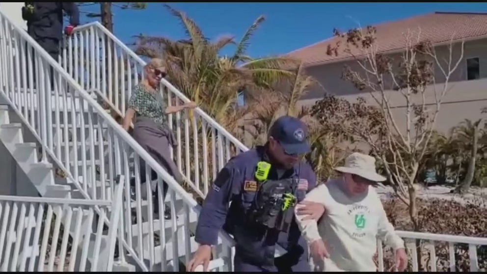 Search and rescue teams help Hurricane Ian victims out of their homes in Fort Myers Beach days after the hurricane made landfall as a Category 4 storm.