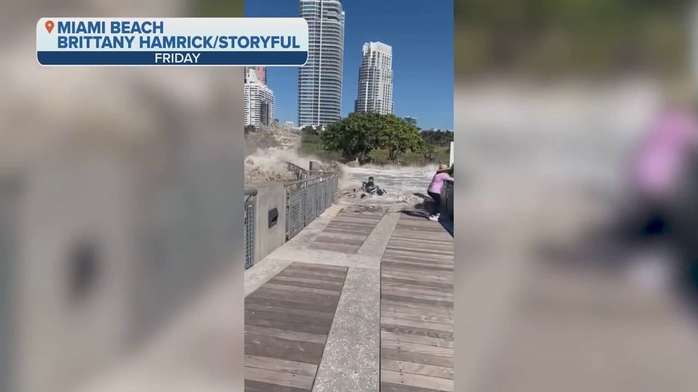 Six people were taken to hospital with minor injuries after a giant wave swept across a sidewalk in Miami Beach, Florida, on Friday, September 30, local media reported. Video by Brittany Hamrick shows a wave sweeping people against a metal railing at South Pointe Park Pier.
