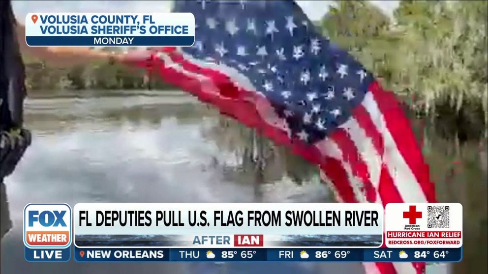 Deputies saw an American flag needing rescue on the rising St. Johns River in Volusia County, Florida.