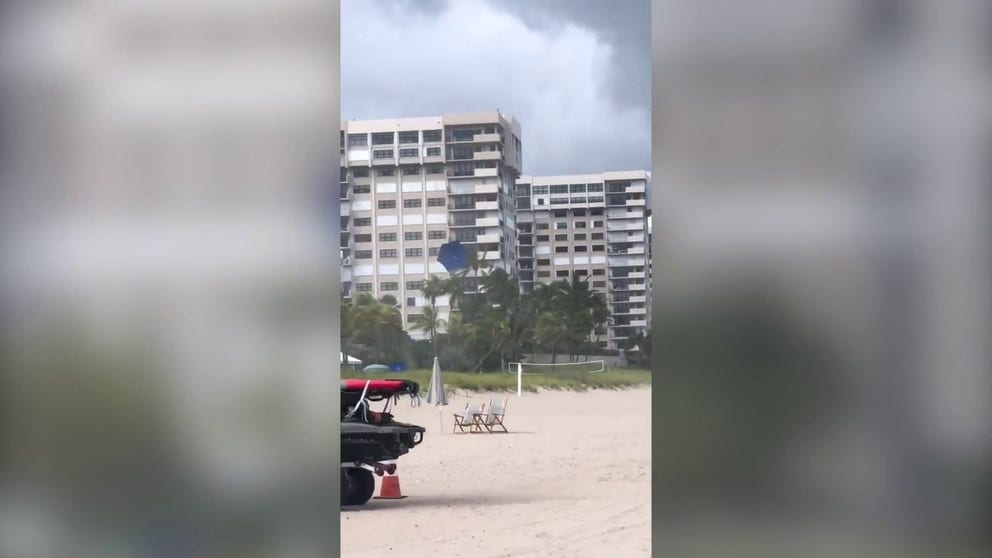Video captures a waterspout sending a beach umbrella flying along a Florida beach. 