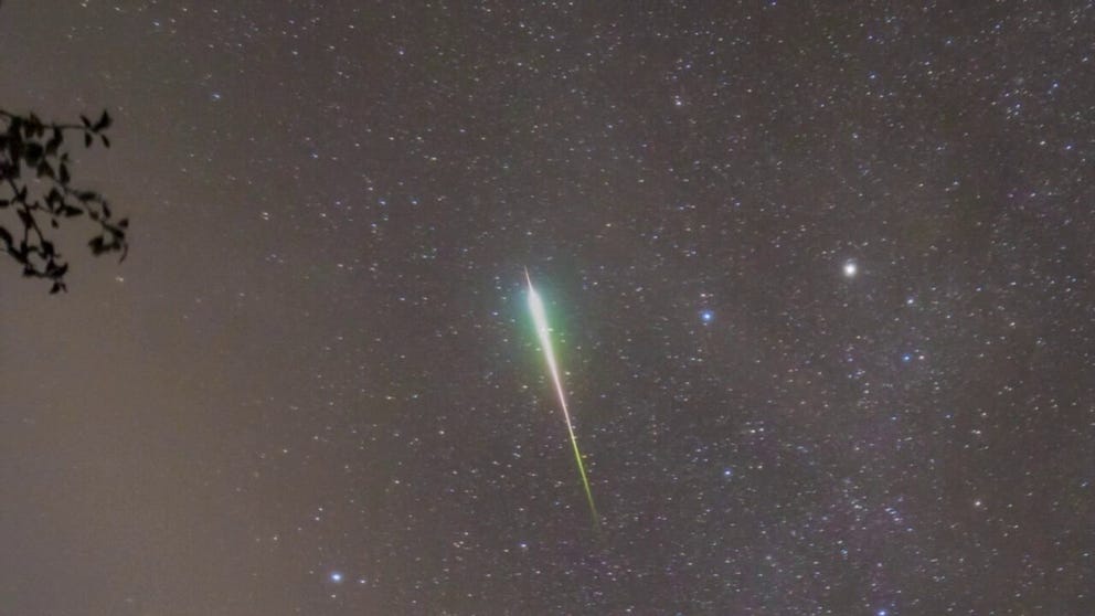 A camera caught a meteor glowing brightly before it slammed into the Earth’s atmosphere during the peak of the Orionid meteor shower early on Friday. 
