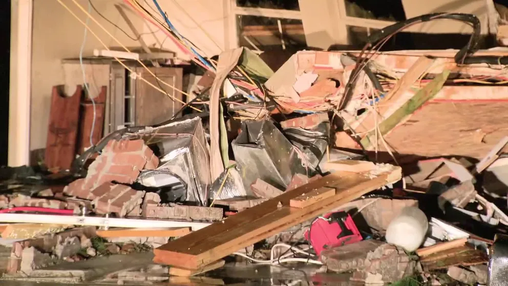 Large piles of debris and destroyed homes in Powderly, Texas following a tornado that rolled through the area. (Credit: KDFW)