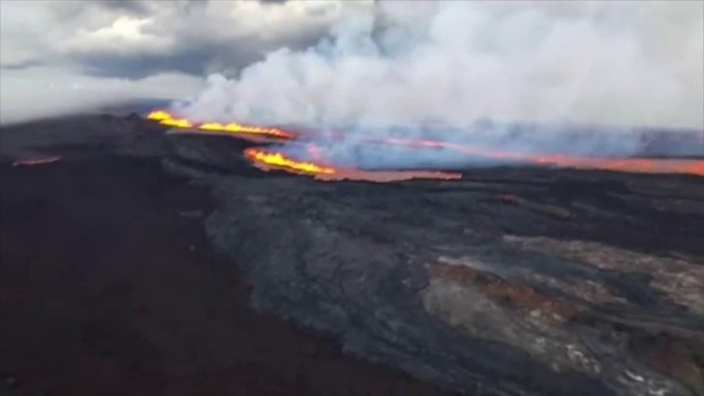 Firefighters captured video of Mauna Loa's eruption from a helicopter on Monday afternoon.