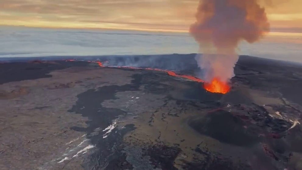 Footage captured by the U.S. Geological Survey (USGS) shows lava spurting from the Mauna Loa volcano in Hawaii moving closer to Daniel K. Inouye Highway on Sunday, Dec. 4.