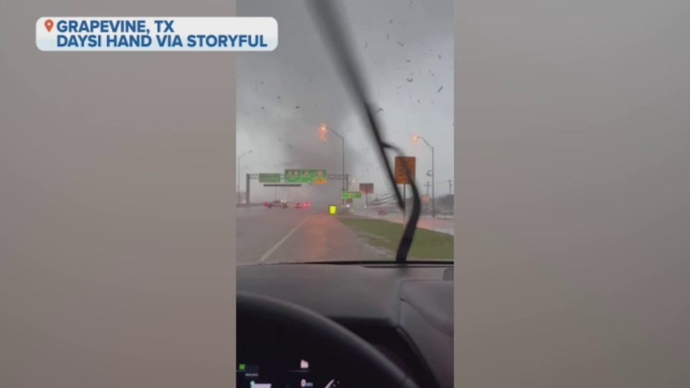 A tornado crossed a Grapevine, Texas highway causing drivers to turn around on Tuesday. 