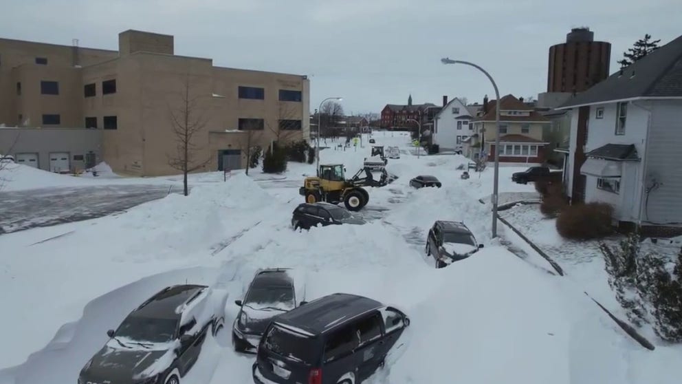 Drone footage shows cars and homes blanketed by heavy snow in Buffalo, New York. (Credit: Earl Reynolds via Storyful) 