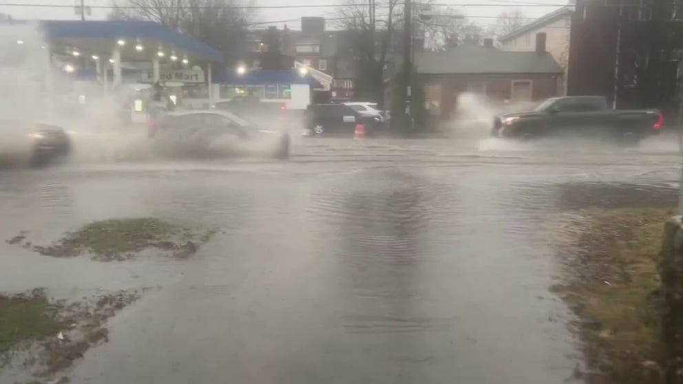 Video posted to Twitter by @ReelistDavid shows vehicles splashing floodwater on West Main Street in Lexington, Kentucky.