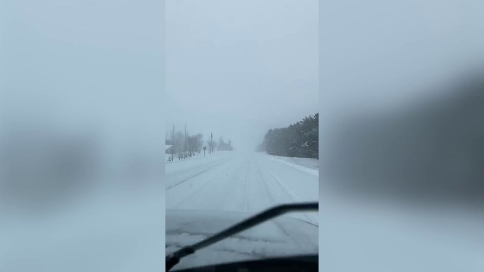 Blowing snow reduces visibility in Cambridge, Minnesota on Monday afternoon. The filmer says there has been 'near whiteout conditions' in the area due to the winter weather. (Credit: @Thoimdamian21 / Twitter)