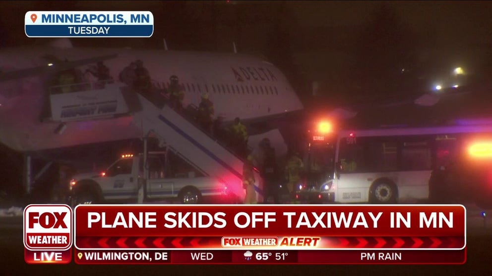 A Delta Air Lines airplane slid off the taxiway at Minneapolis-St. Paul International Airport during snowy and icy conditions on Tuesday night.